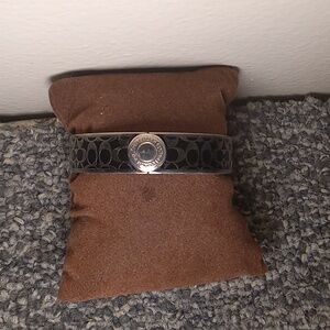 Coach black enamel and sliver tone embossed front clasp braclet